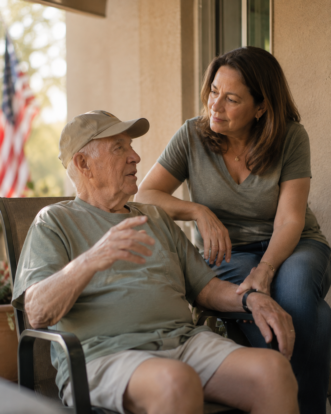 A veteran on a porch with his daughter
